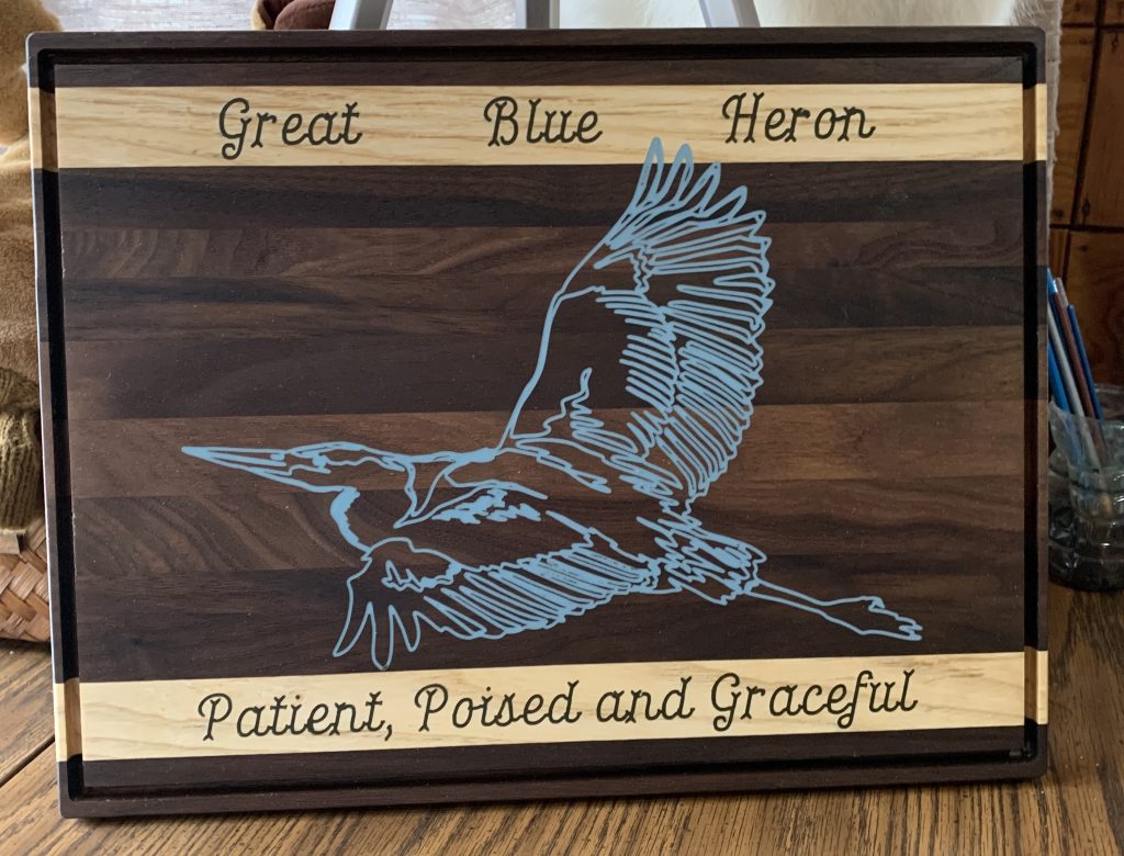 Charcuterie board with a heron.