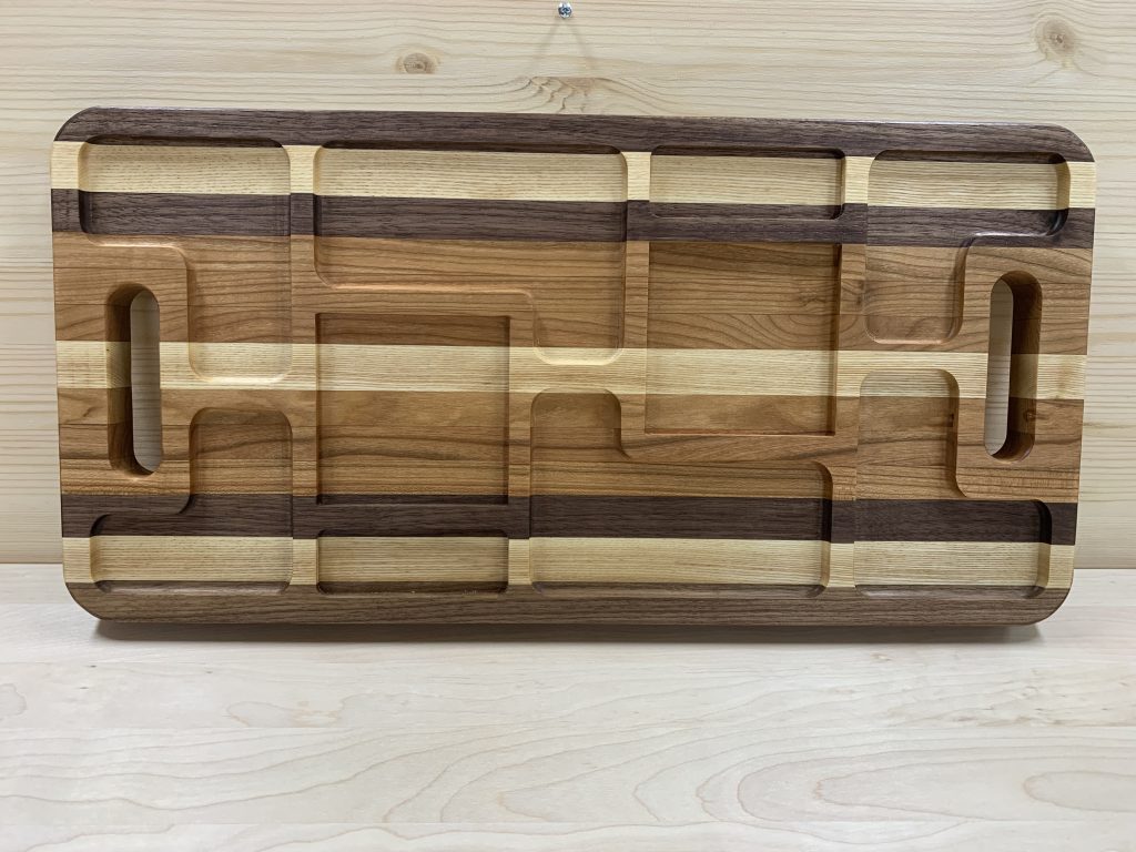 Our serving trays are sold with no-slip grips and wall hanging hardware. All are finished to be food-safe.