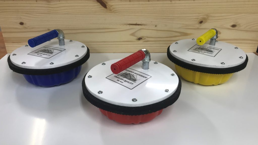 Outdoor Curling Stones in three colours.